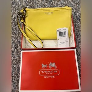 Coach yellow (lemon) wristlet. New with tags.